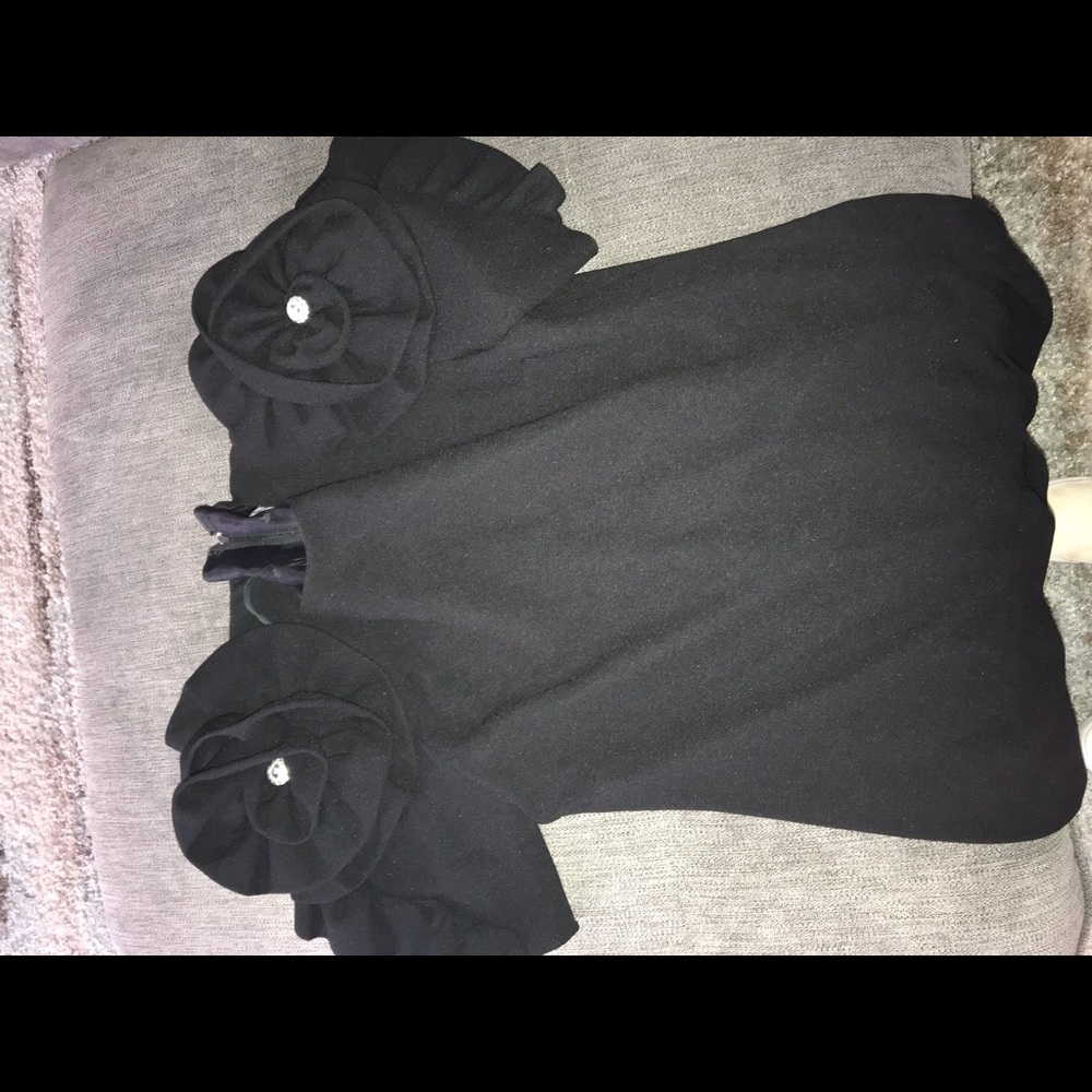 Black Nui dress with flowers and gems .